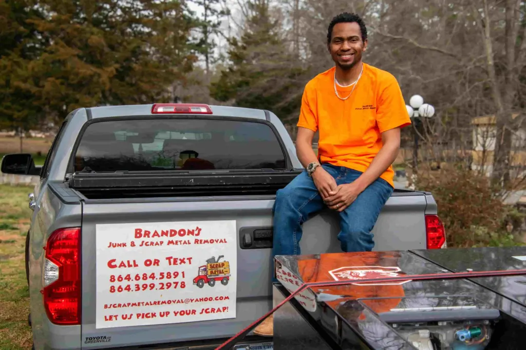 One Call Hauling truck and team member promoting junk removal service in Greenville SC